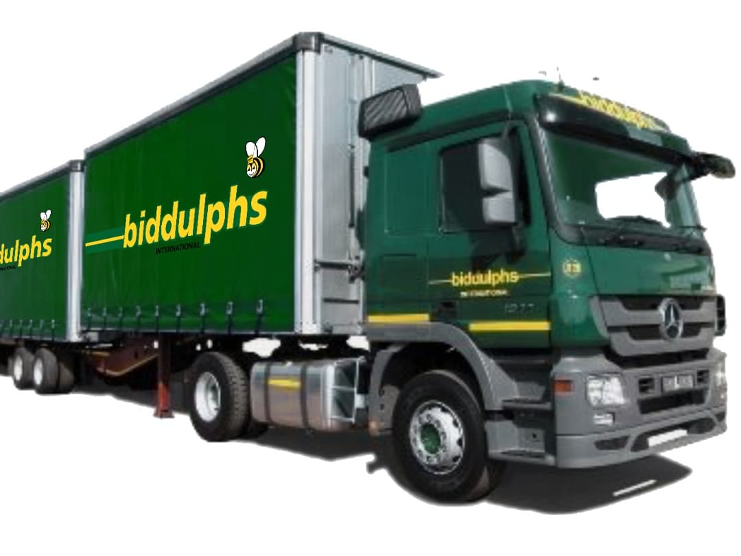 A green Biddulphs Freight curtain-side truck and trailer